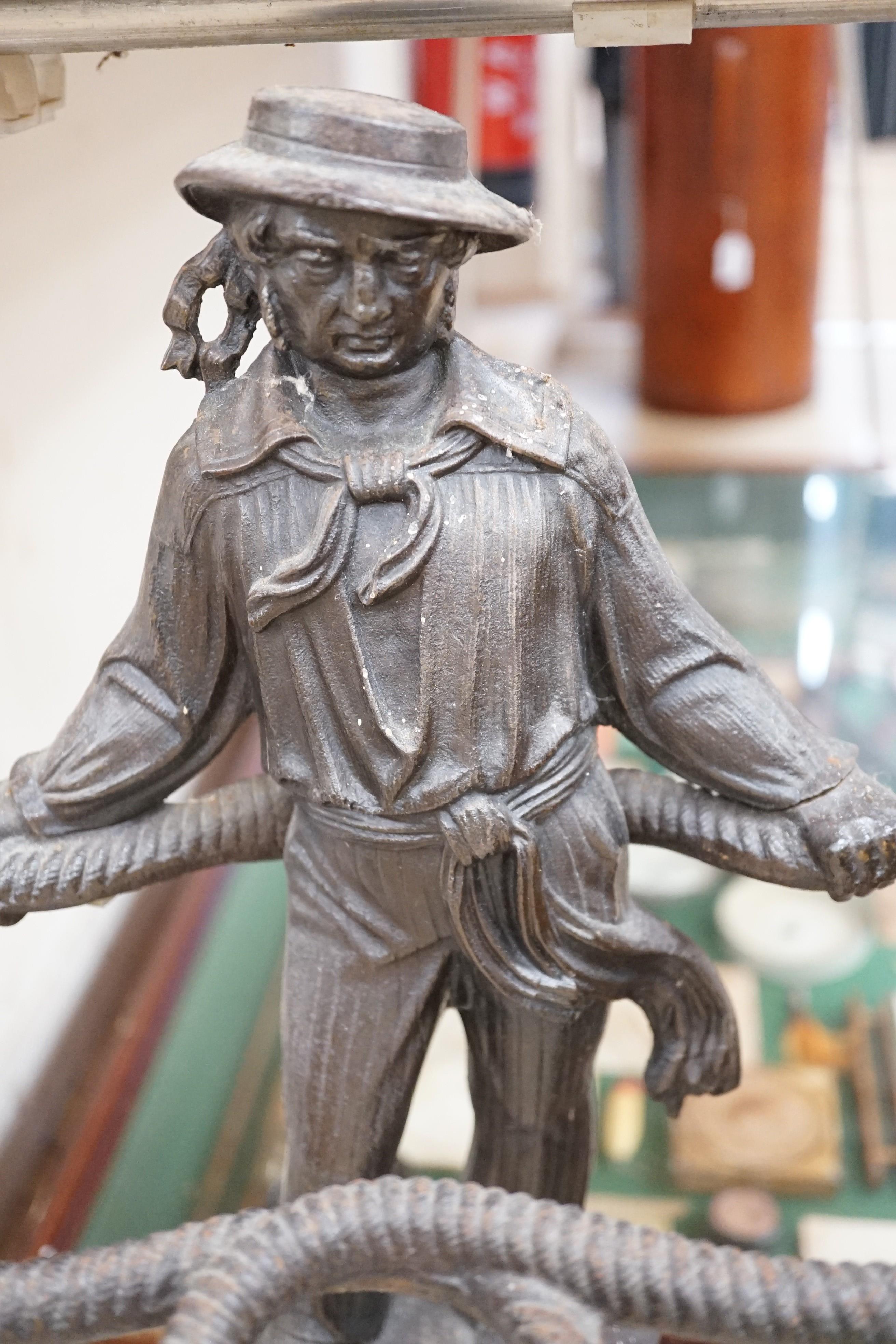 A figural cast iron ‘sailor’ stick stand, 70cms high